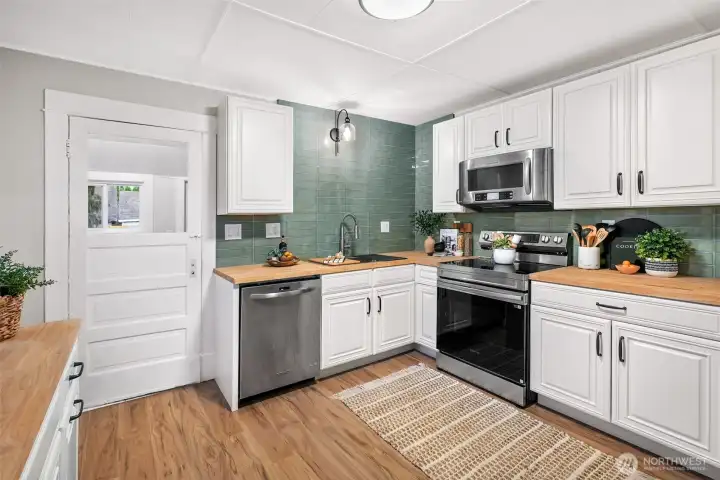 Fully remodeled kitchen with new butcher block countertops and all new cabinets.