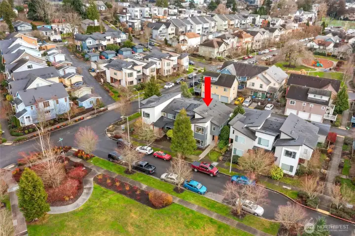 Aerial view looking south, including the open park space across the street from this home.