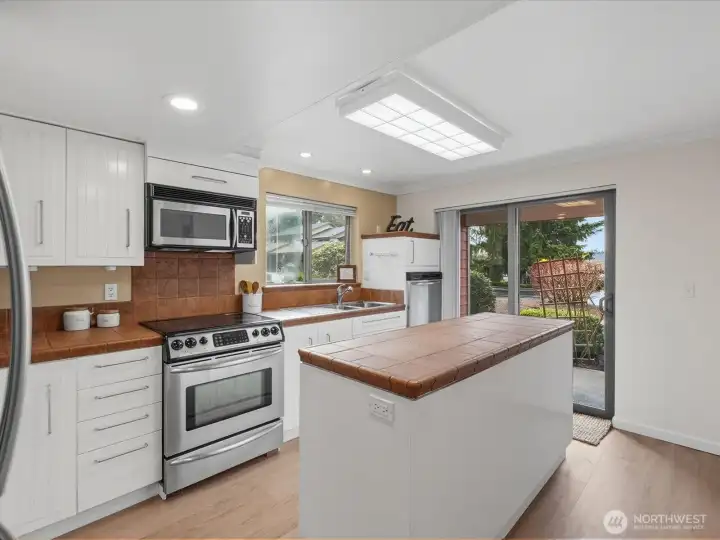 The kitchen offers tons of storage and counter space.