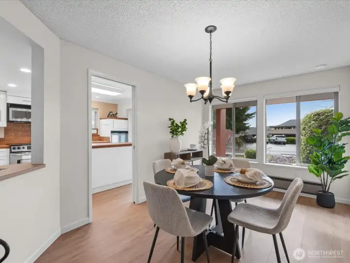 Formal dining room has a slider that opens up to the oversized patio.