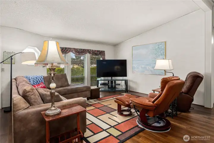 Comfortable living room offers multiple seating options and a warm, inviting layout ideal for everyday relaxation.