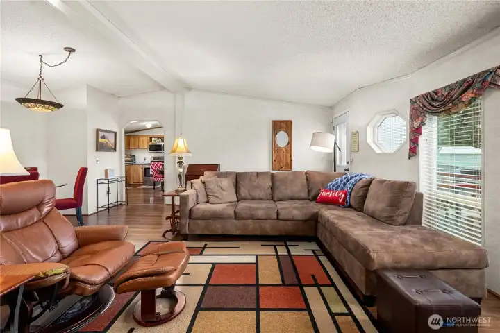 Spacious living room with vaulted ceilings provides an open, airy feel perfect for gathering or unwinding.