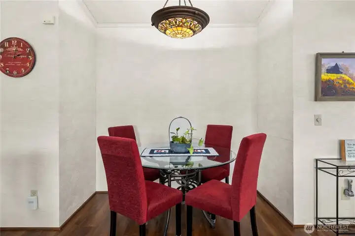 Cozy dining area is perfectly sized for intimate meals and easy entertaining.