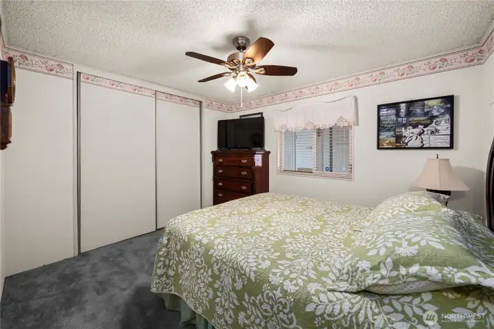 Comfortable guest bedroom provides flexibility for visitors, hobbies, or quiet relaxation.