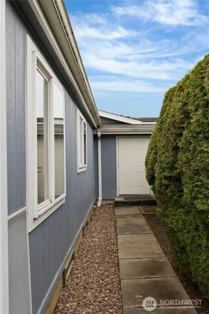 Side with access to garage from backyard