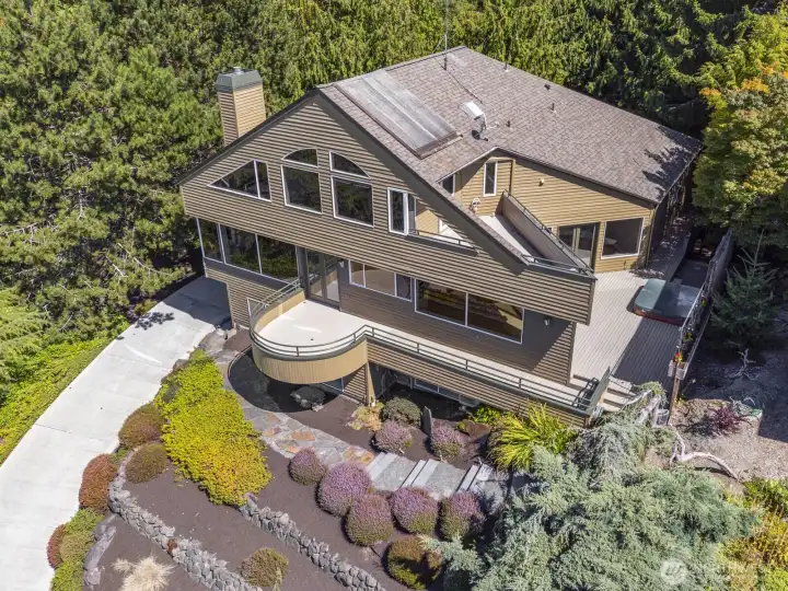 Exquisite example of a NW Contemporary home design. High ceilings, big view windows and outdoor space. Note the very private setting.