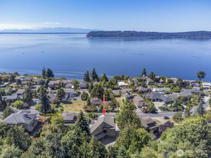 Located in the heart of the coveted Chennault Beach neighborhood. The home looks due west to Possession Point on Whidbey Island, across the shipping lanes of Admiralty Inlet to the Olympic Range in the distance.