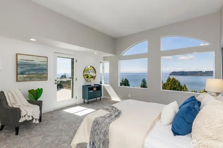 You can lay in bed and enjoy the views! Possession Point, the south tip of Whidbey Island, is front and center. The door goes from the primary bedroom to the view deck.
