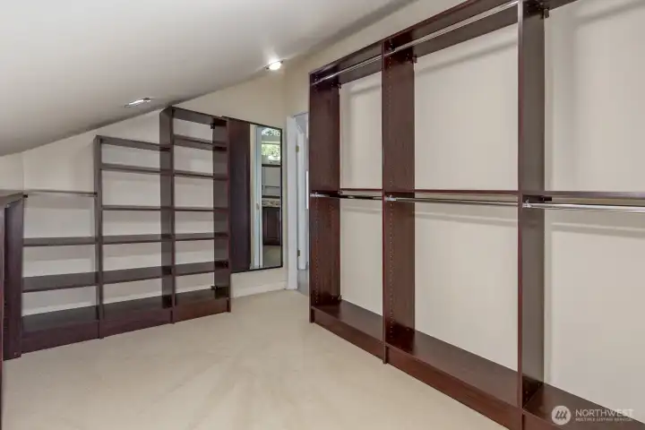 The walk in closet with custom built ins.