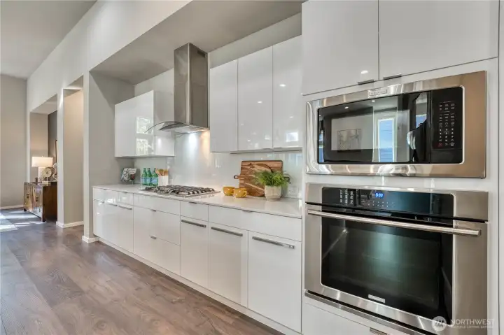 Sleek white cabinets and stainless appliances