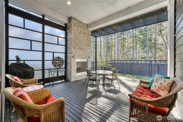 Covered patio with gas fireplace and custom shoji screen for added privacy.