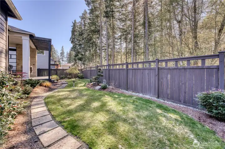 Low maintenance yard backs up to large greenbelt for added privacy.