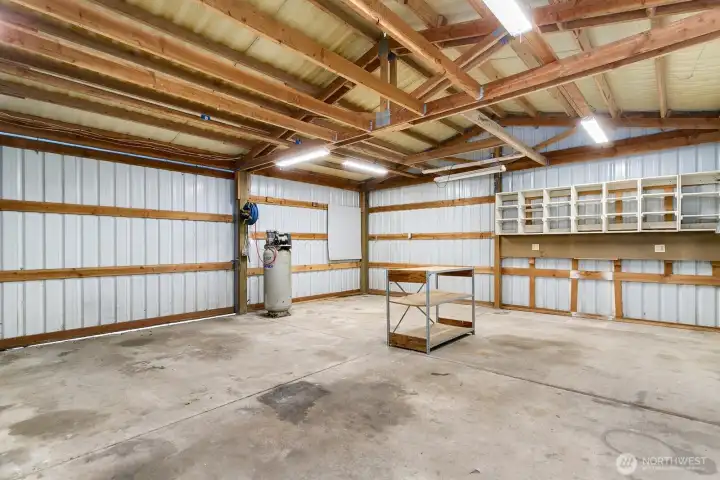 Shop is perfect for hobbies and projects with built in cabinets and air compressor