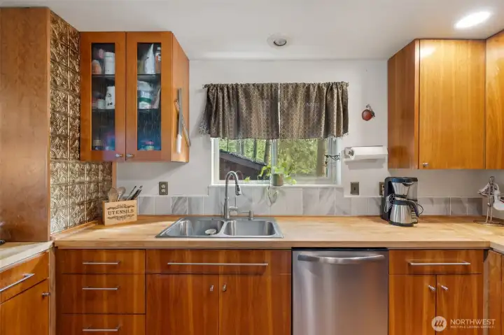 Beautiful kitchen with butcher block counter tops.