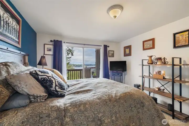 Main floor Primary opens to expansive deck with views.