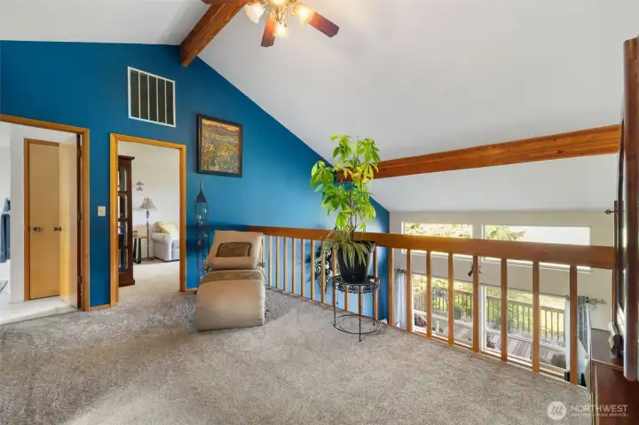 Upper level loft area looking over main living area.