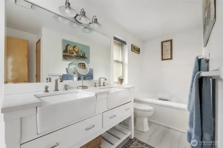 Upper level bathroom with double sinks.