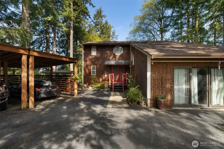 New carport and entrance to bonus room addition.