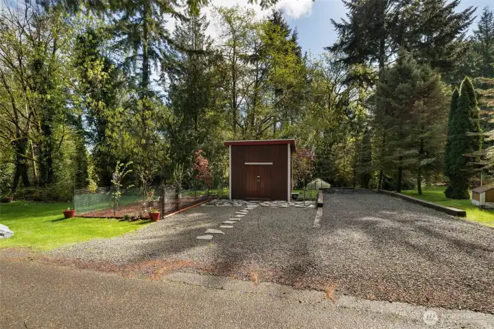 2025 Shed with a loft, fruit trees, a green house, and RV parking.