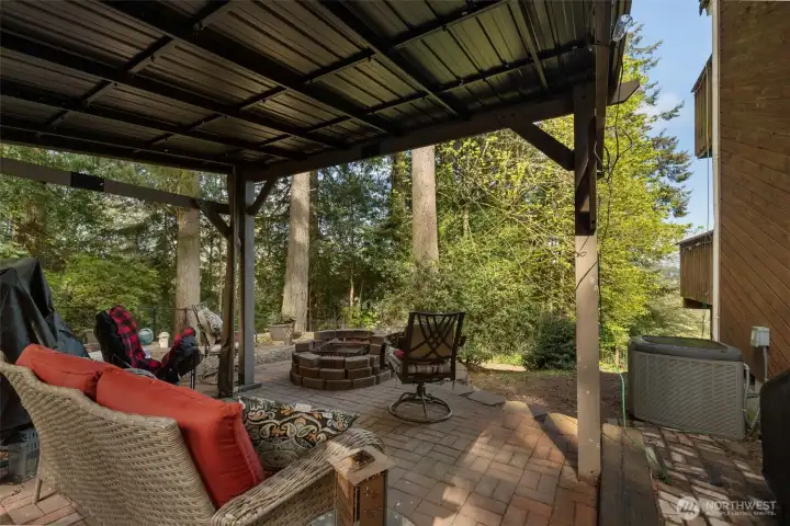 Enjoy the covered area under the gazebo or gather around the firepit.