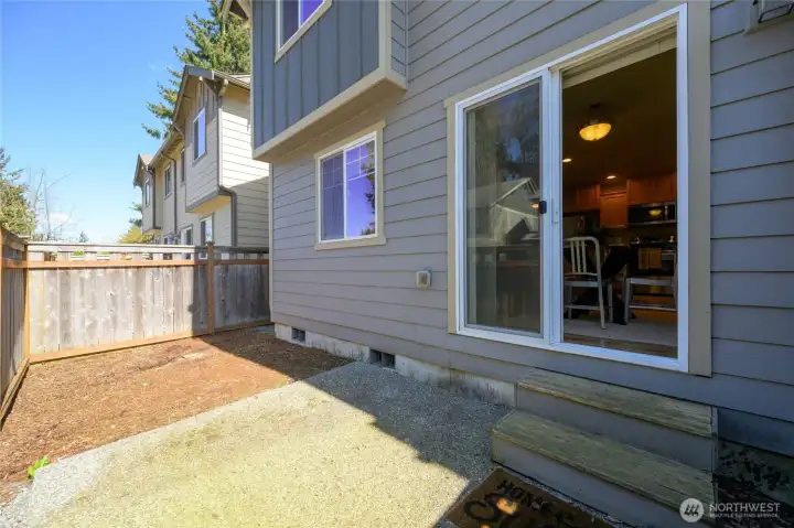 back patio and fenced yard