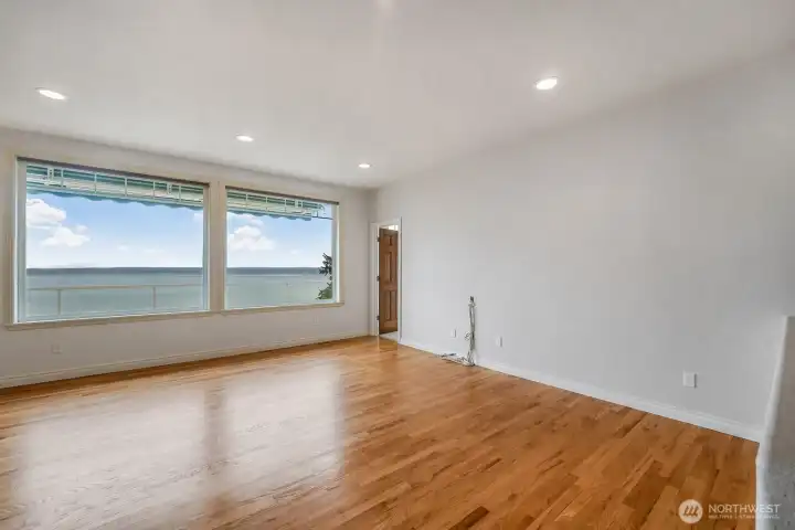 Spacious family room offers plenty of wall space for artwork or an entertainment unit!