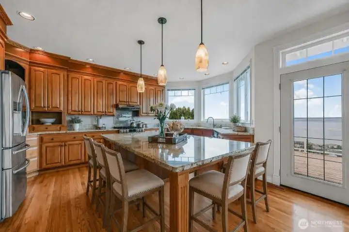 Kitchen island can seat 6 guests while entertaining!