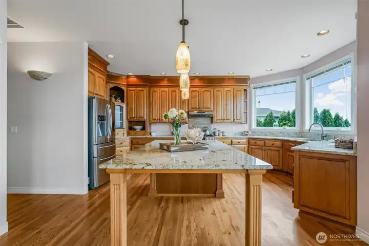 Beautiful kitchen offers granite counter tops & stainless appliances.