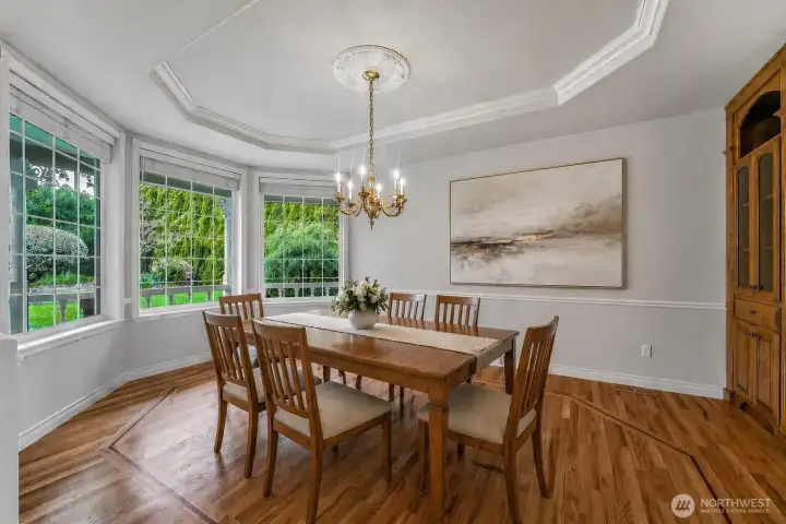 Beautiful dining room with view of the garden virtually staged.