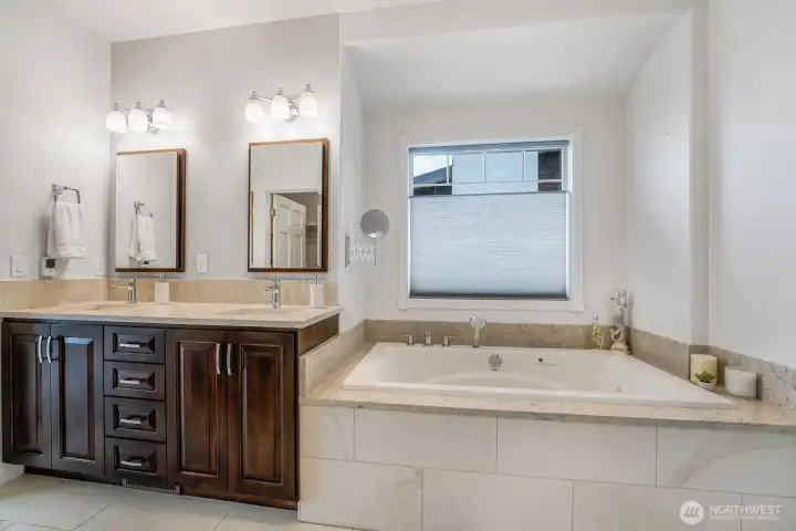 Beautiful primary bath offers a jetted tub & walk in shower.