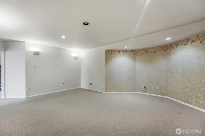 Downstairs a theater room or spacious family room for guests & family!