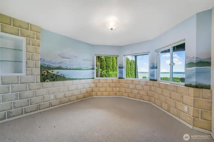 Guest Bedroom 1 features a walk in closet and lots of windows to enjoy the view!
