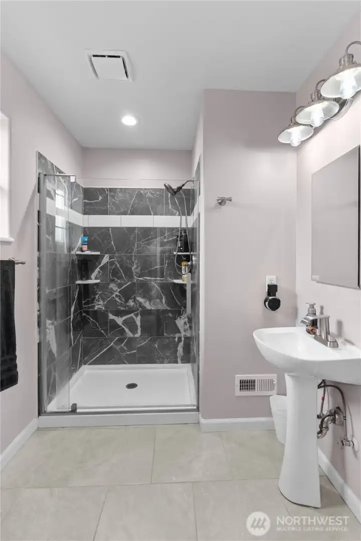 PRIMARY BATHROOM | REMODELED WITH TILED SHOWER