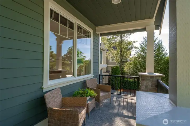 Charming covered front porch offering a warm and welcoming arrival