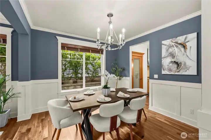 Formal dining room and a stunning chandelier that creates a warm, sophisticated ambiance
