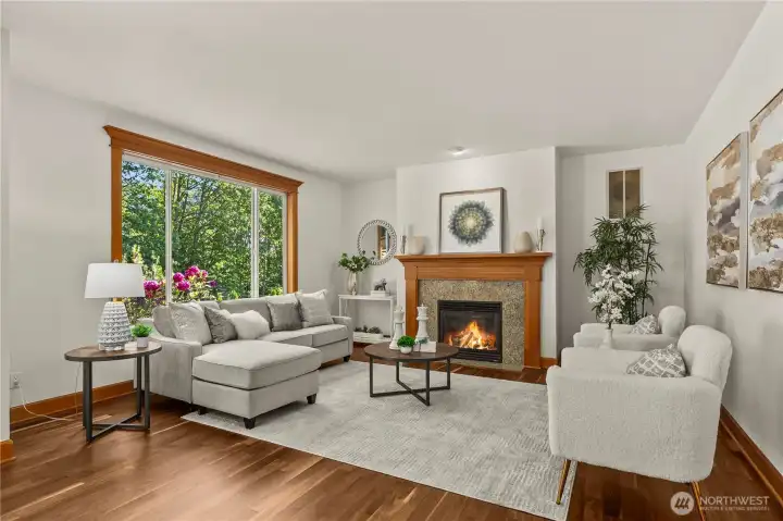 Warm and inviting family room centered around a beautiful fireplace, offering the perfect space for everyday living and gathering