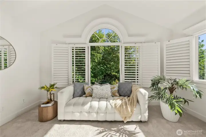 Spacious sitting area overlooking peaceful greenery