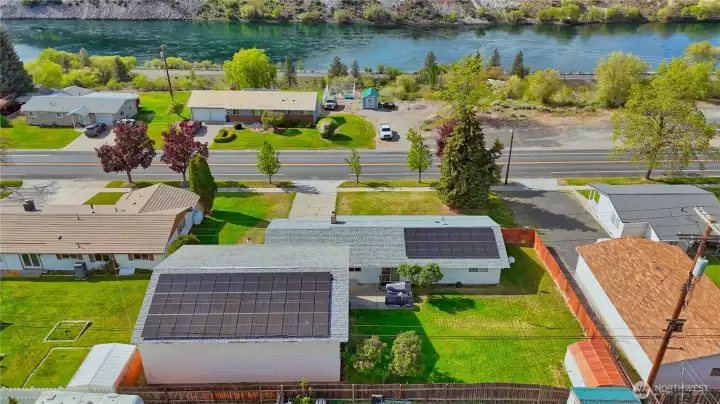 Grid-tied solar panels help lower overall energy costs and improve energy efficiency.