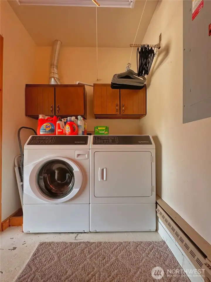 Laundry room with additional storage space.