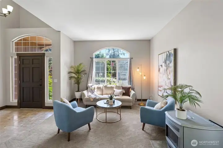 A view of the front door and living room from the dining room. A pellet stove adds extra warmth and ambience to the main level.