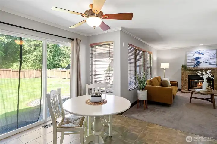 The kitchen, nook, and gathering place with gas fireplace flow seamlessly into each other.