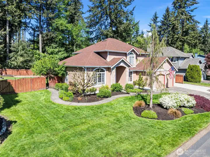This yard enjoys a sprinkler system for easy watering of the lawn and plants, allowing this yard to stay green all year.