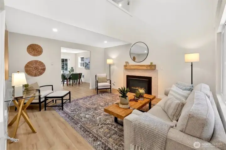 Studs out remodel. Living room with Cathedral ceilings and fireplace.