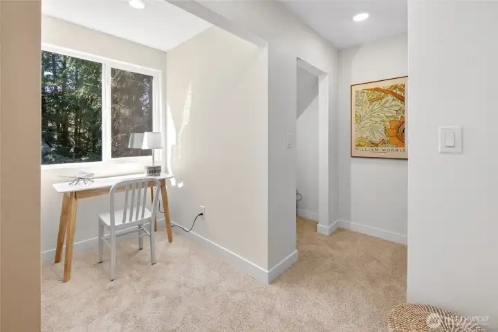 Primary Suite alcove for desk, make-up, nursery, art, etc. and two closets.