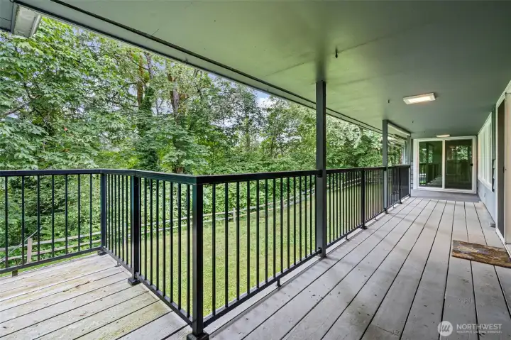 Large wrap around deck goes from kitchen, dining room, living room and to bedroom.