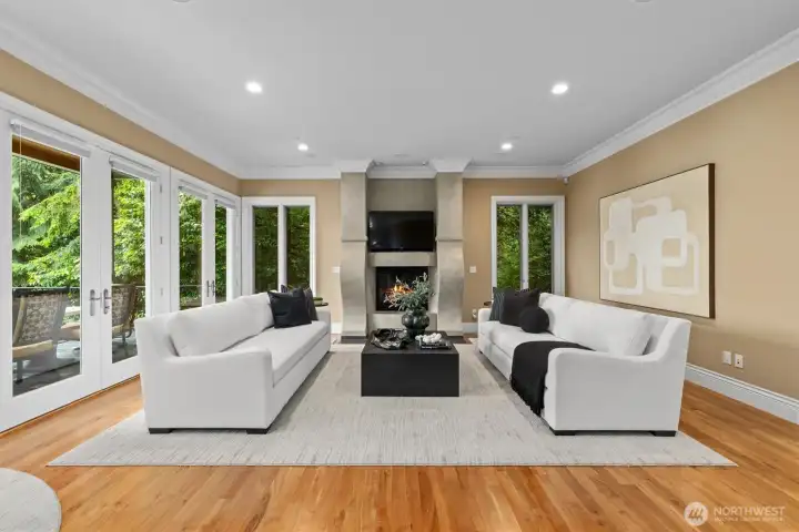 Continue into the comfortable living room with dual sets of French doors opening to the terrace. Continue into the comfortable living room with dual sets of French doors opening to the terrace.