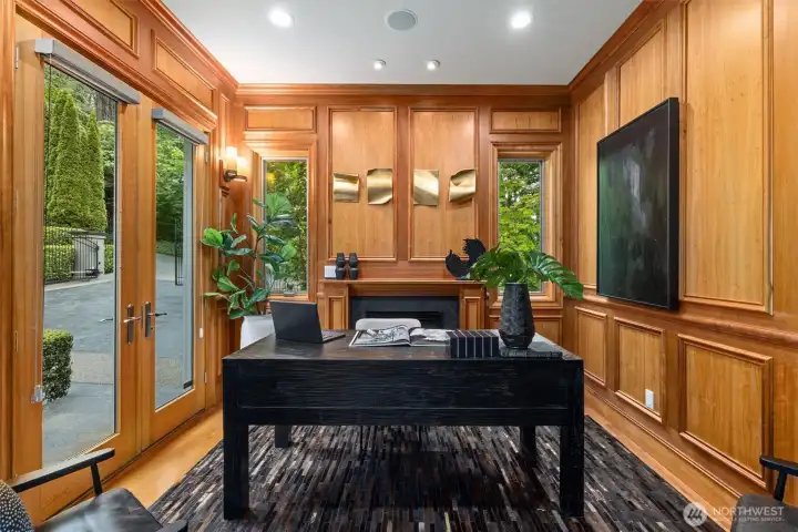 Tucked away off the foyer, the richly finished office offers its own fireplace & private access to the front driveway. Tucked away off the foyer, the richly finished office offers its own fireplace & private access to the front driveway.