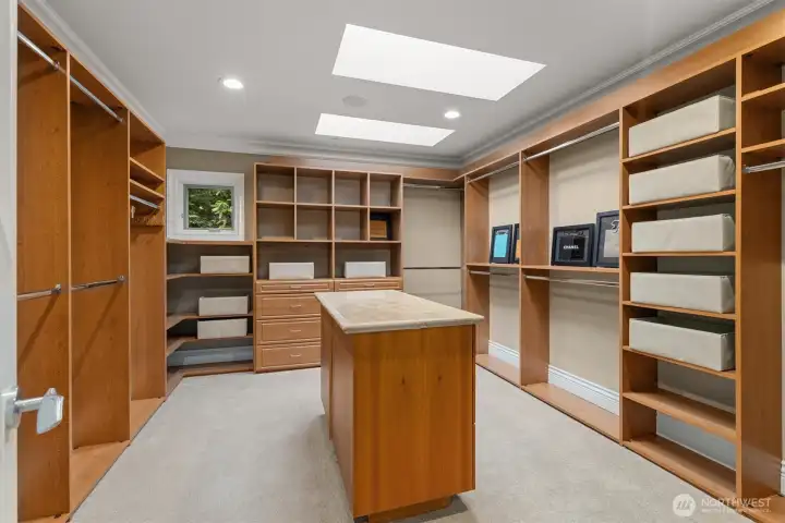 Dream walk-in closet with custom organizers & the benefit of natural light from skylights. Dream walk-in closet with custom organizers & the benefit of natural light from skylights.