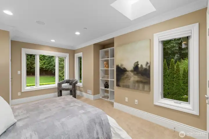 The second upper bedroom suite features its own balcony overlooking the lush back yard. The second upper bedroom suite features its own balcony overlooking the lush back yard.