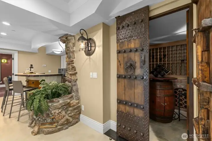 Imported Italian doors adorn the 500+ bottle, temperature controlled wine cellar. Imported Italian doors adorn the 500+ bottle, temperature controlled wine cellar.